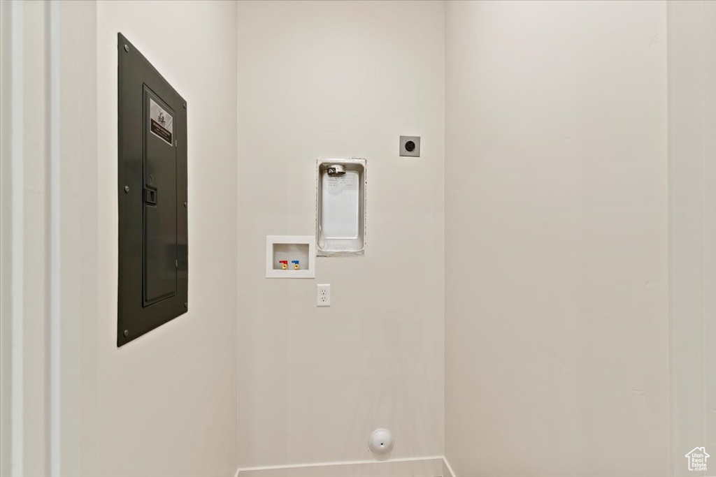 Laundry room featuring hookup for a washing machine, electric dryer hookup, electric panel, and hookup for a gas dryer