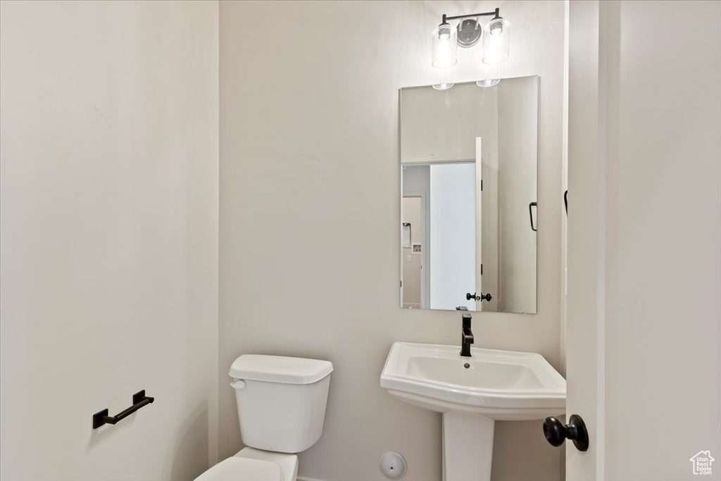 Bathroom featuring toilet and a sink