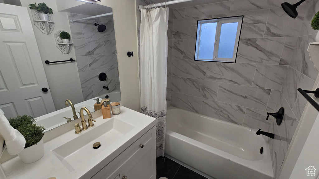 Full bathroom featuring shower / tub combo and vanity