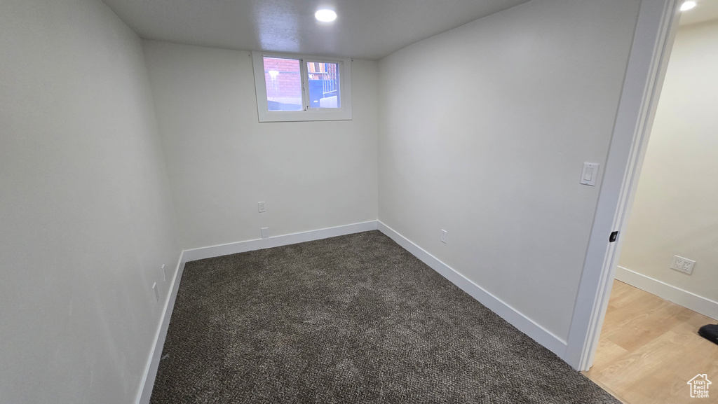 Below grade area with wood finished floors and baseboards