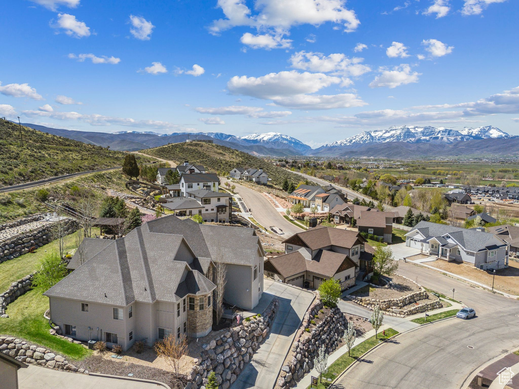 Birds eye view of property with a residential view and a mountain view
