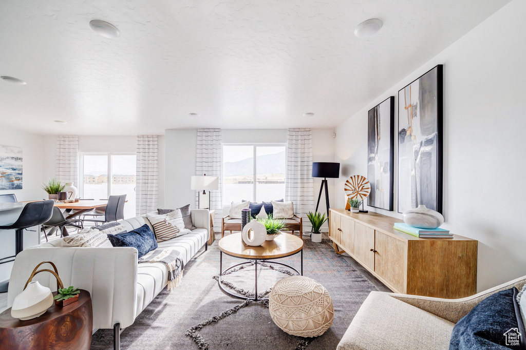 Living area with plenty of natural light and a textured ceiling