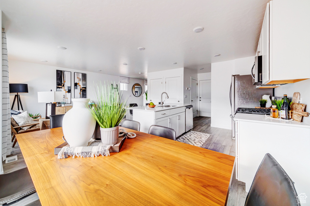 Dining space featuring dark wood-style floors
