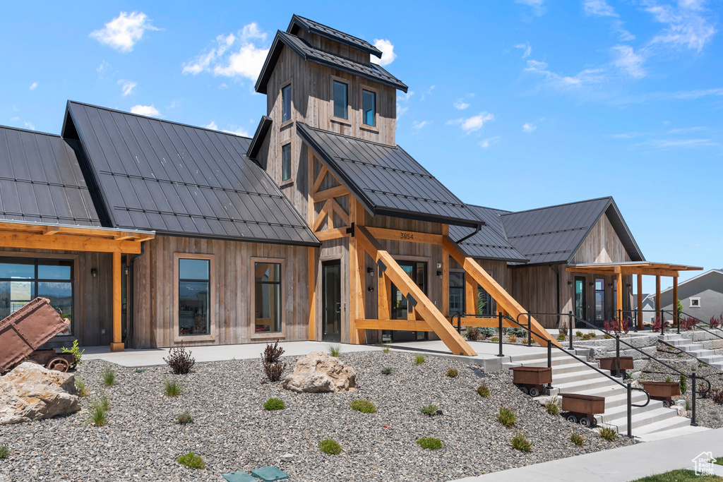 View of front facade featuring metal roof and a standing seam roof