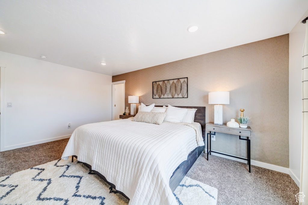 Carpeted bedroom featuring recessed lighting and baseboards