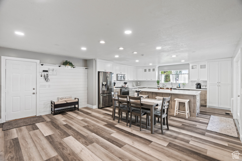 Dining area featuring recessed lighting and wood finished floors