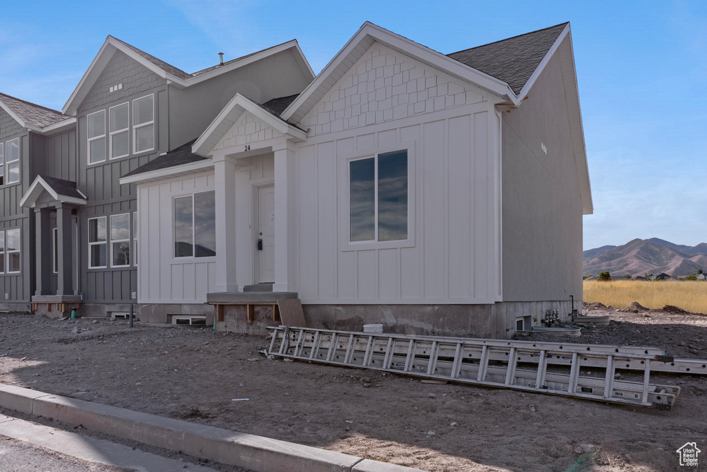 View of front of house featuring a mountain view