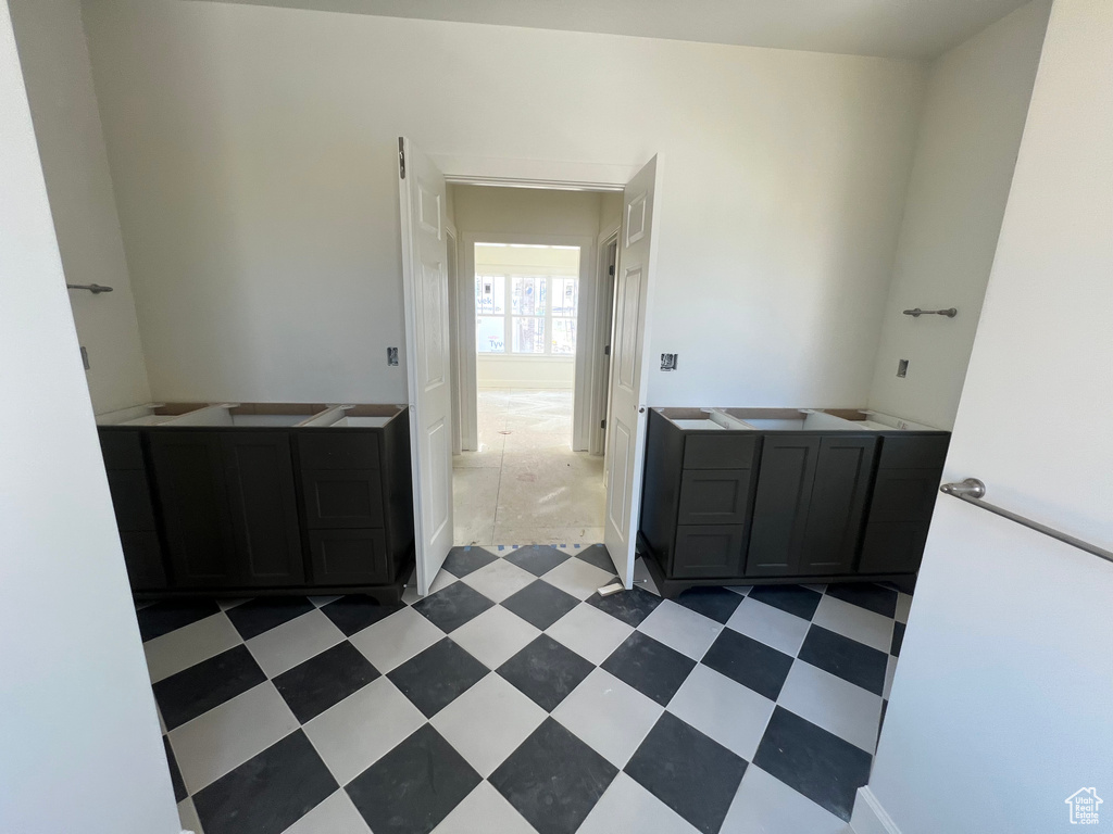 Bathroom with vanity and tile patterned floors