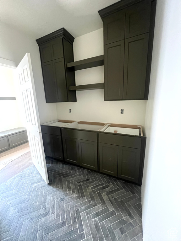 Kitchen with stovetop and open shelves
