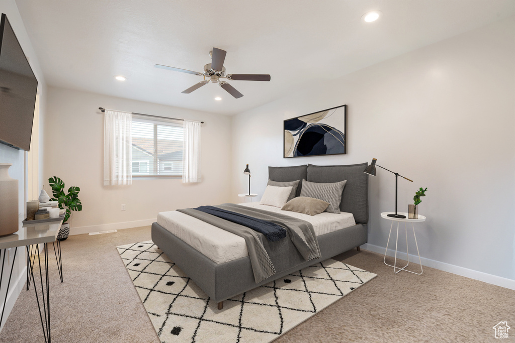 Bedroom featuring light carpet, recessed lighting, and ceiling fan