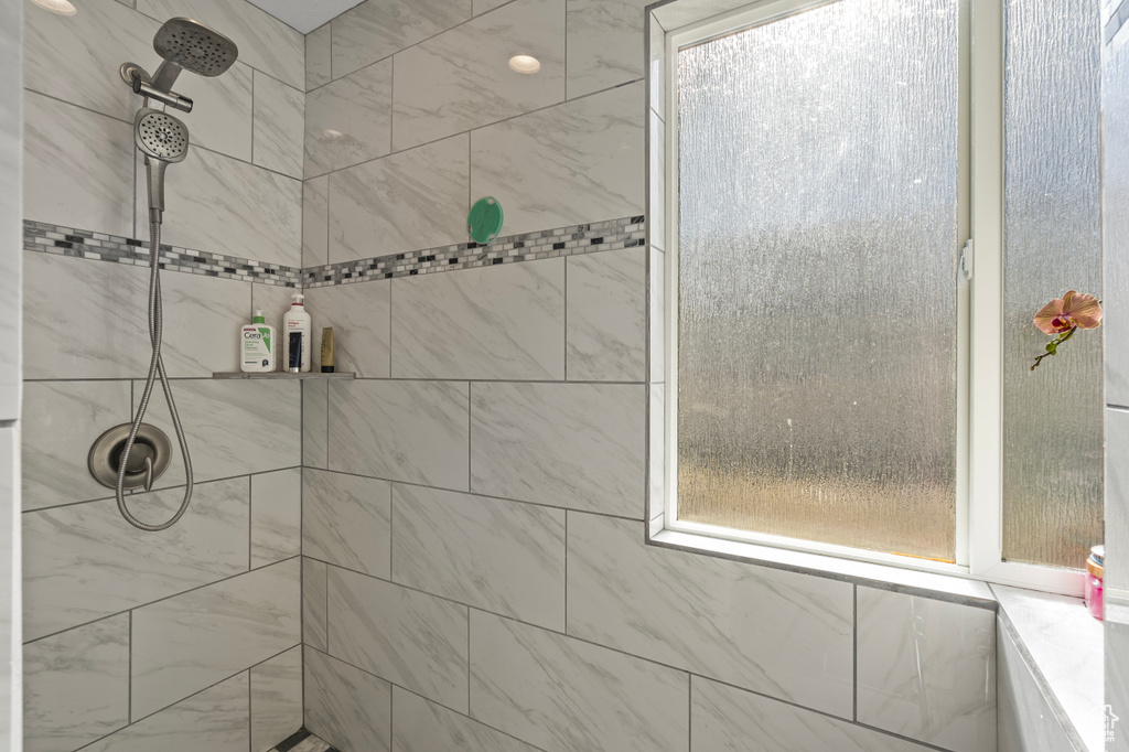 Full bath with a tile shower