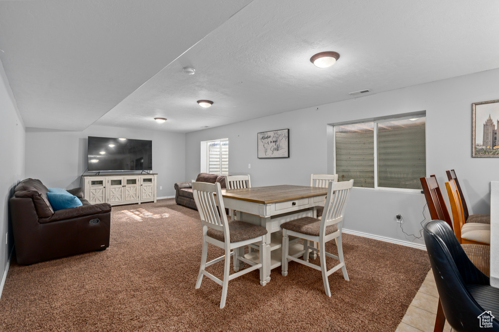 Dining area with visible vents and baseboards