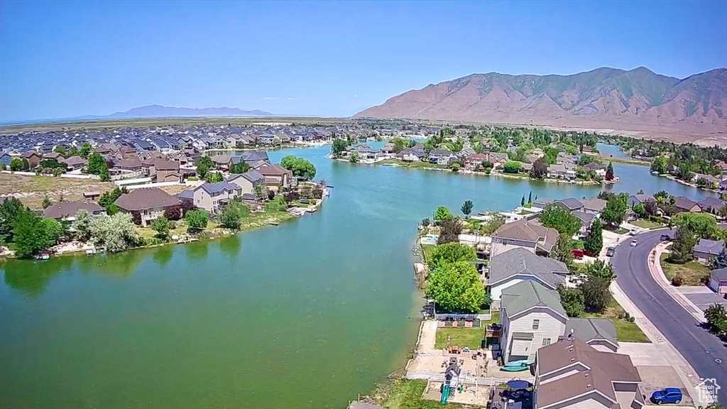 Aerial perspective of suburban area featuring a water and mountain view