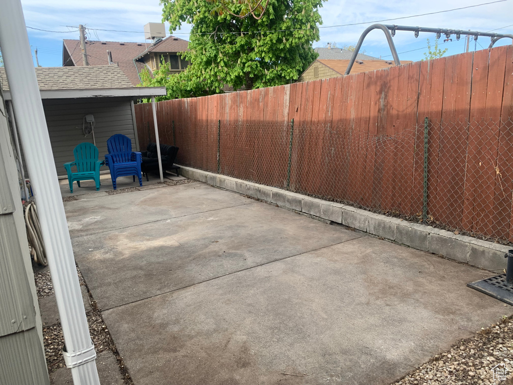 View of patio with a fenced backyard