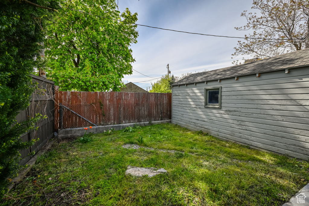 View of yard featuring a fenced backyard
