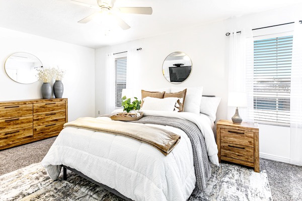 Bedroom with carpet floors and a ceiling fan