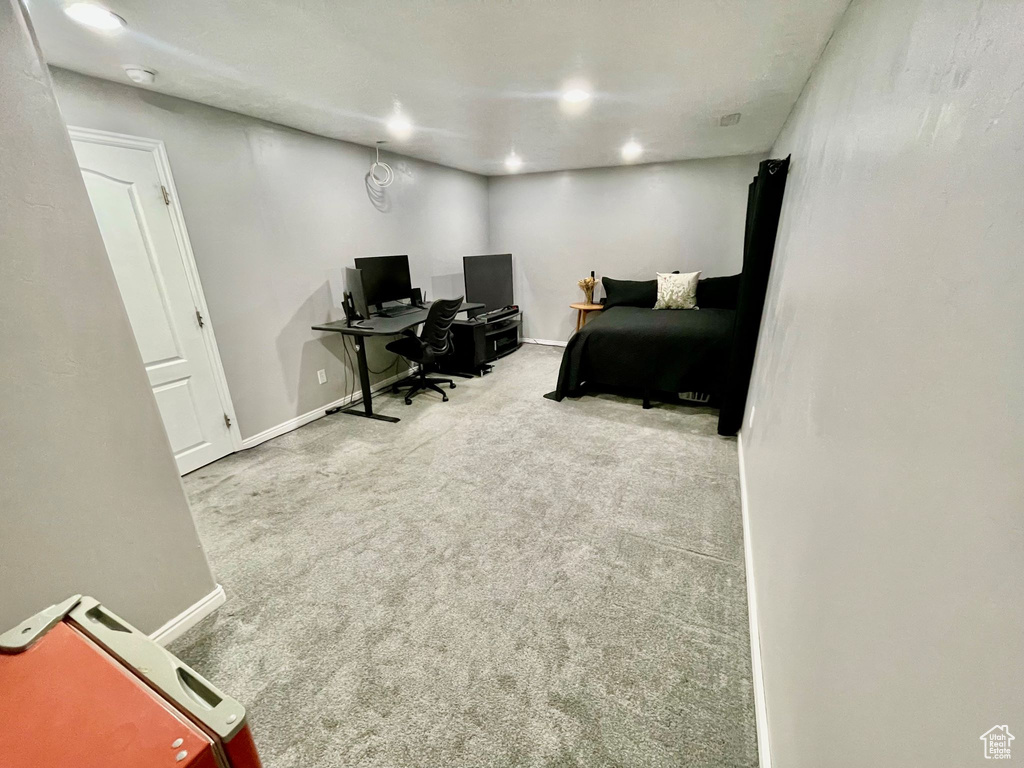 Carpeted bedroom with baseboards