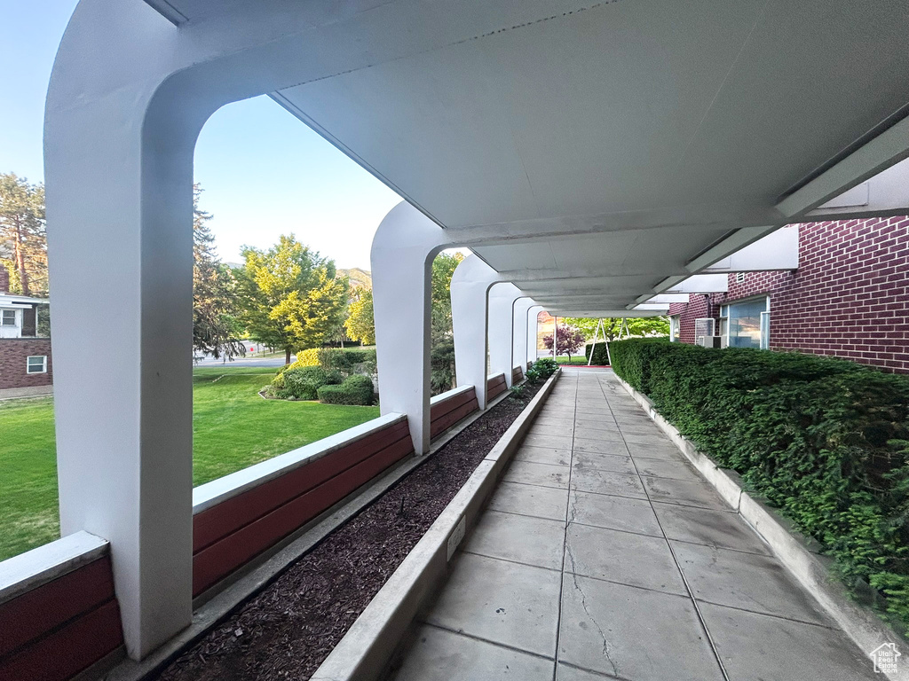 View of home's community with a lawn
