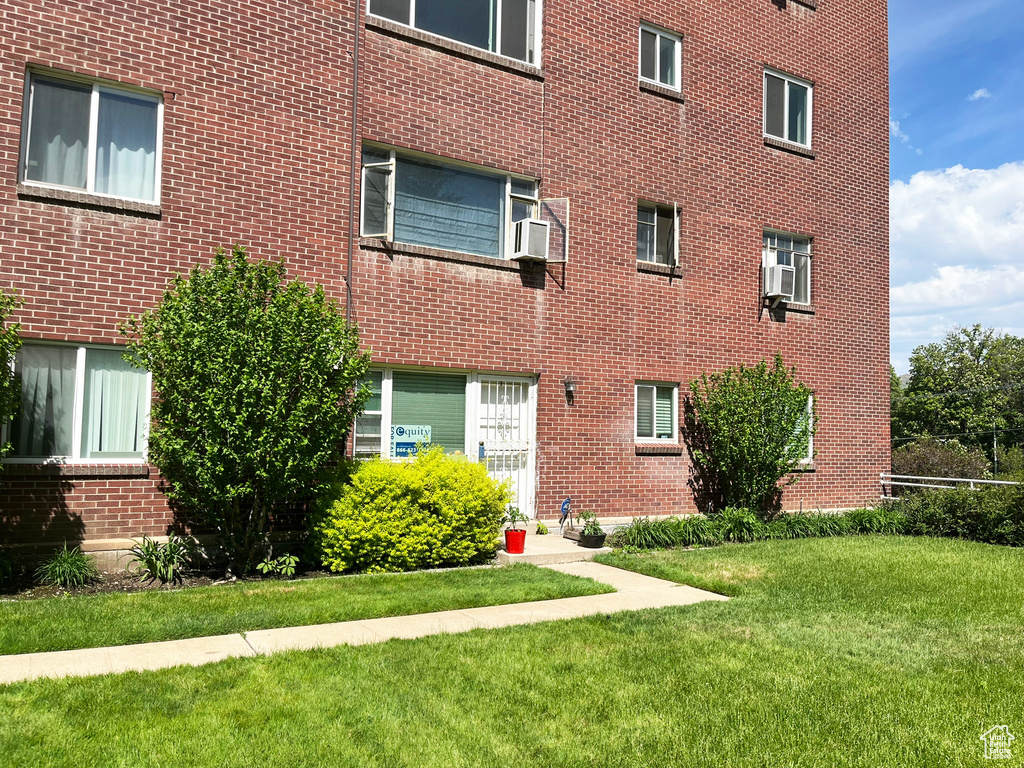 View of property with cooling unit