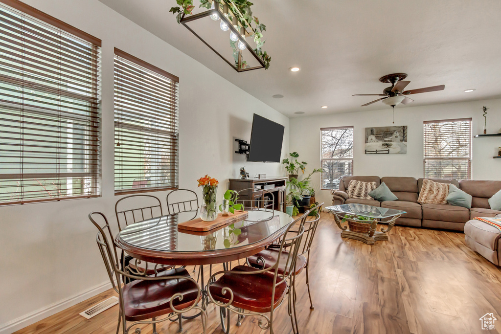 Dining space featuring ceiling fan, recessed lighting, visible vents, baseboards, and light wood-type flooring