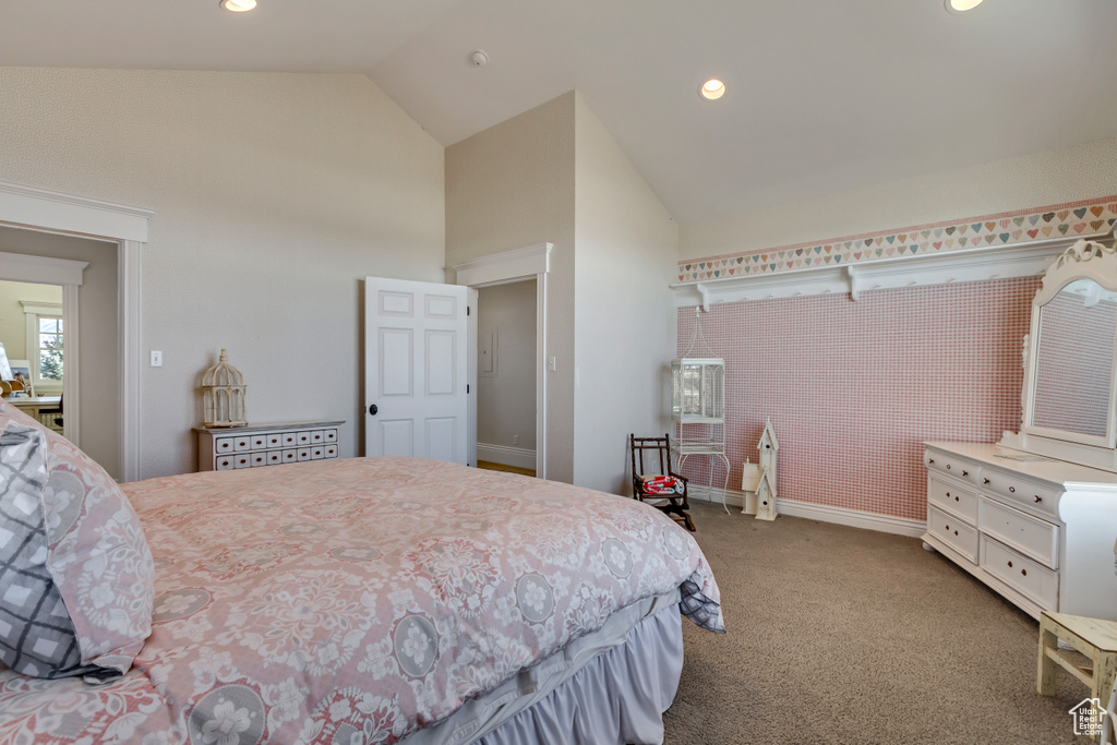 Carpeted bedroom with high vaulted ceiling, recessed lighting, and baseboards