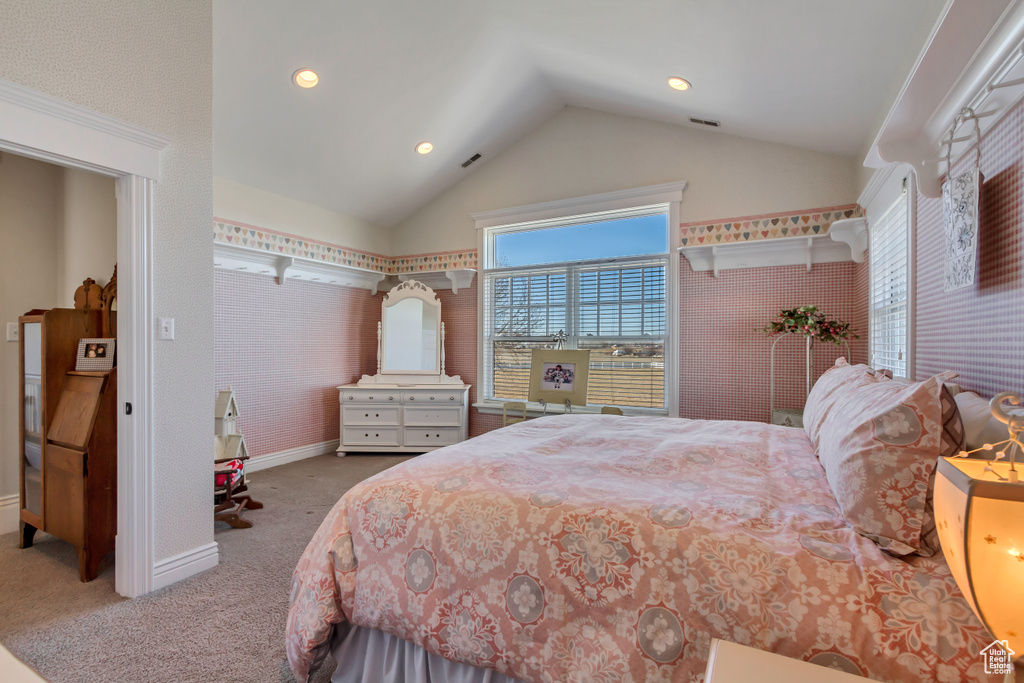 Carpeted bedroom with lofted ceiling, recessed lighting, visible vents, and baseboards