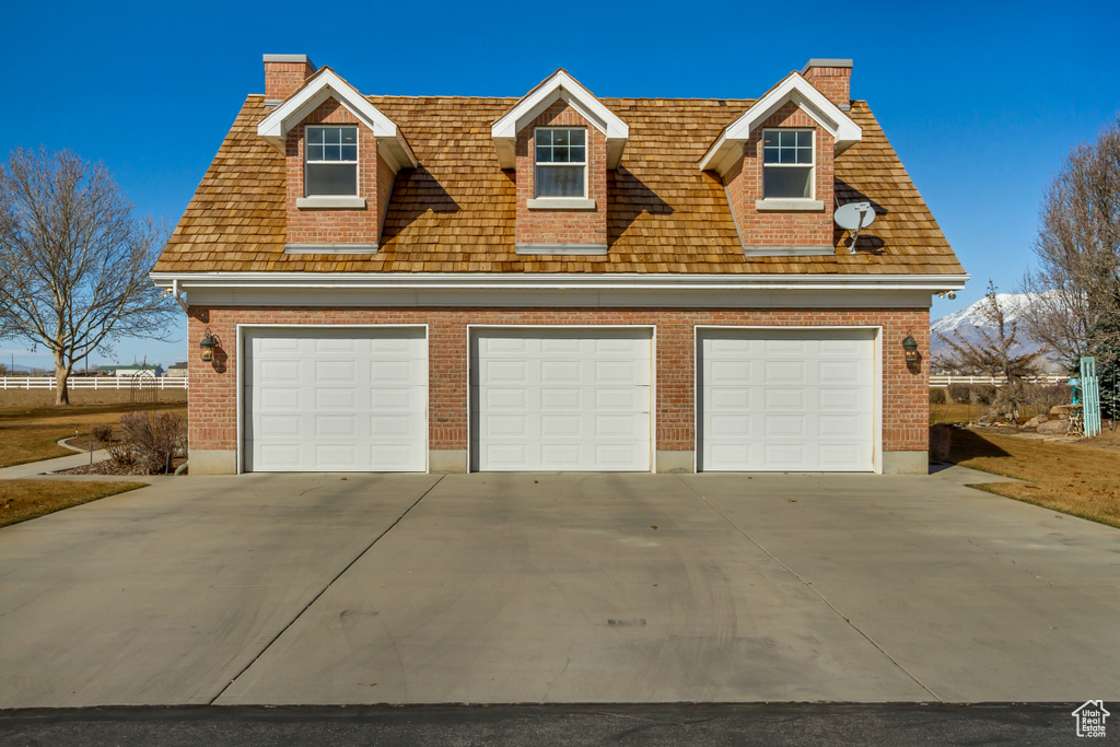 Garage featuring a detached garage