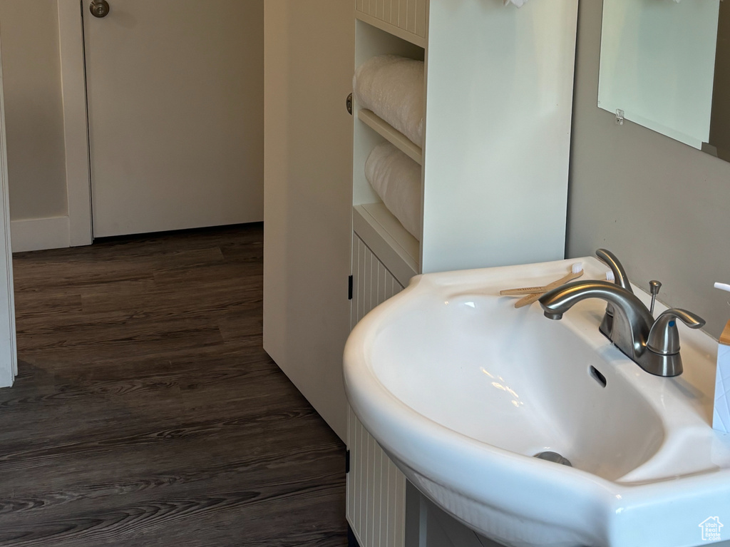 Bathroom with a sink and wood finished floors
