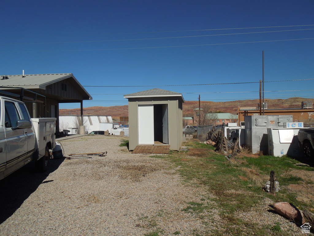 View of yard with a shed and an outdoor structure