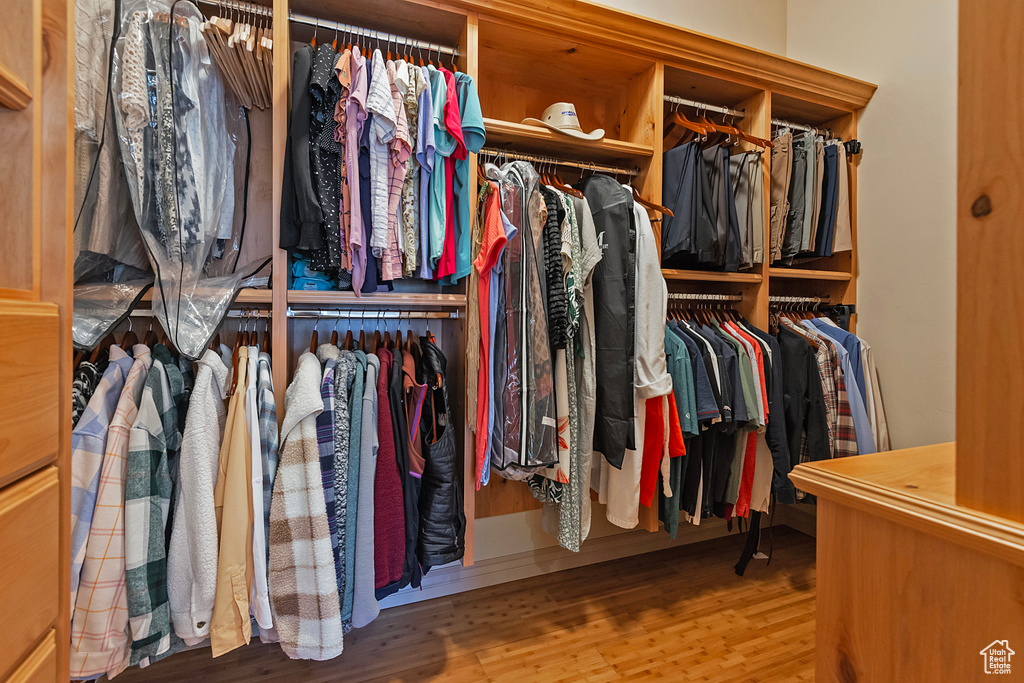 Walk in closet featuring wood finished floors