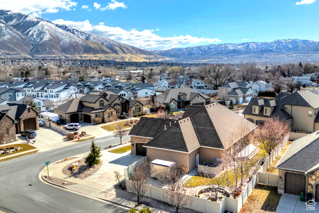 Birds eye view of property with a residential view and a mountain view