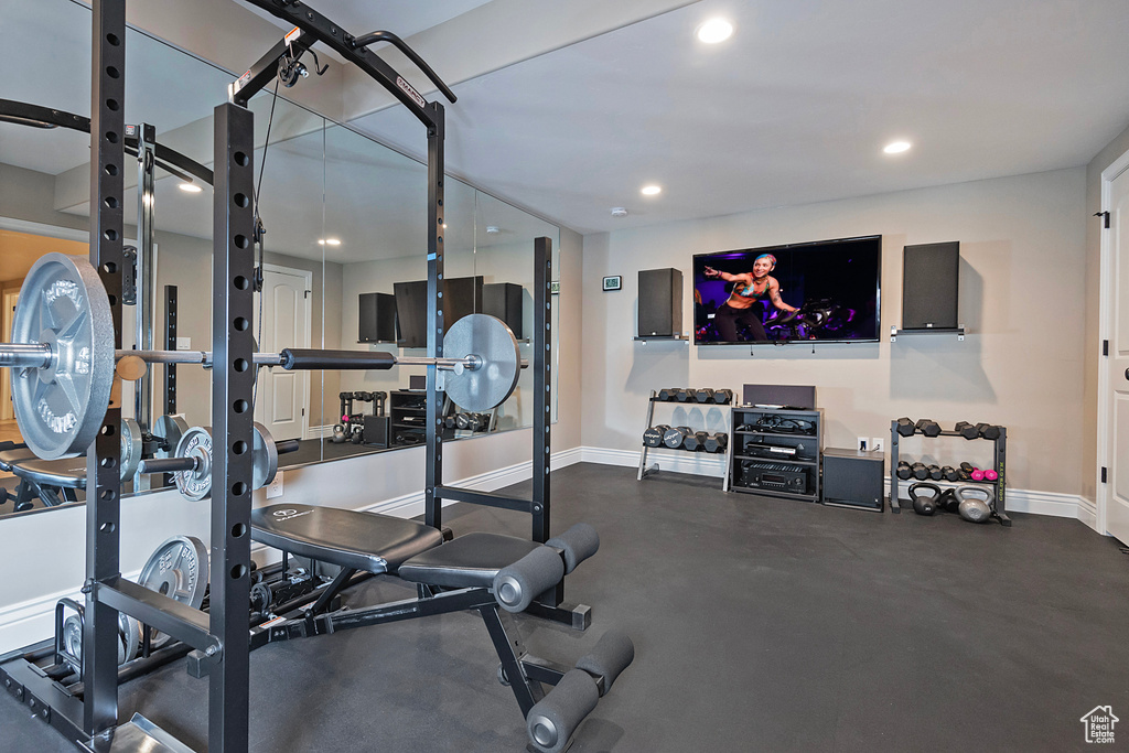 Workout area with recessed lighting and baseboards