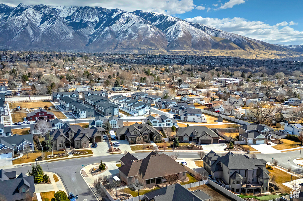 Birds eye view of property with a residential view and a mountain view