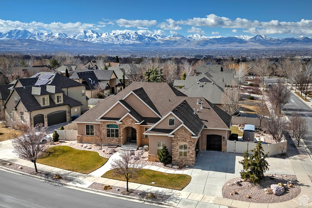 Drone / aerial view with a residential view and a mountain view