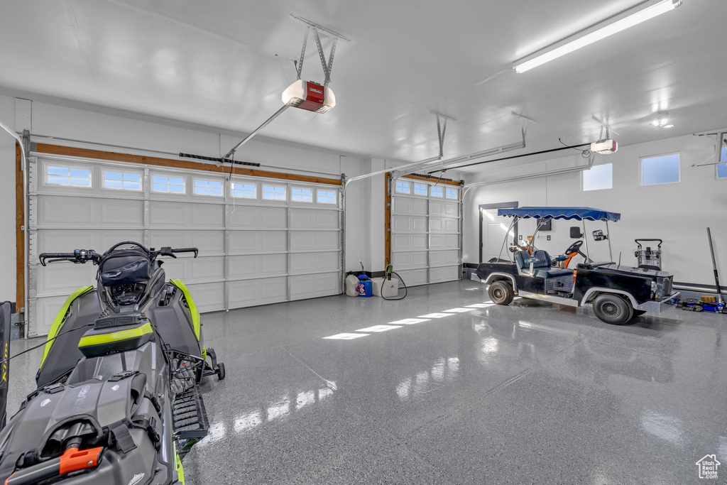 Garage featuring a garage door opener