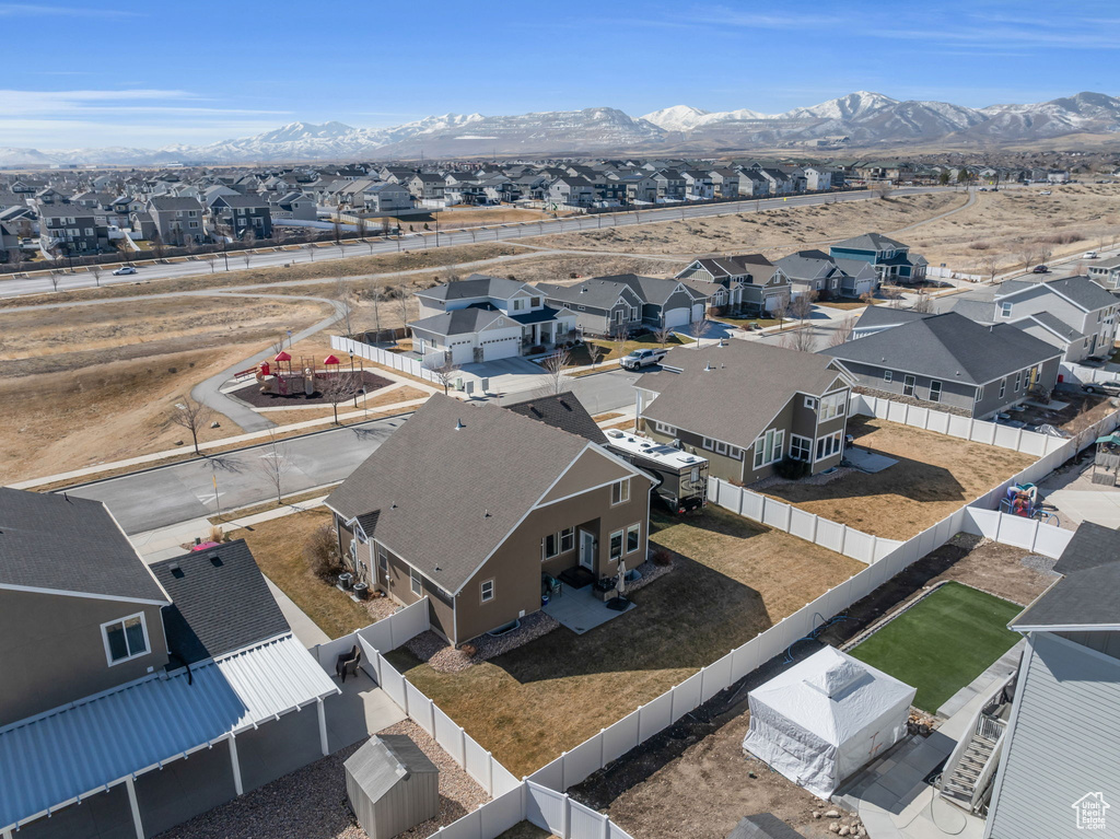 Drone / aerial view with a residential view and a mountain view