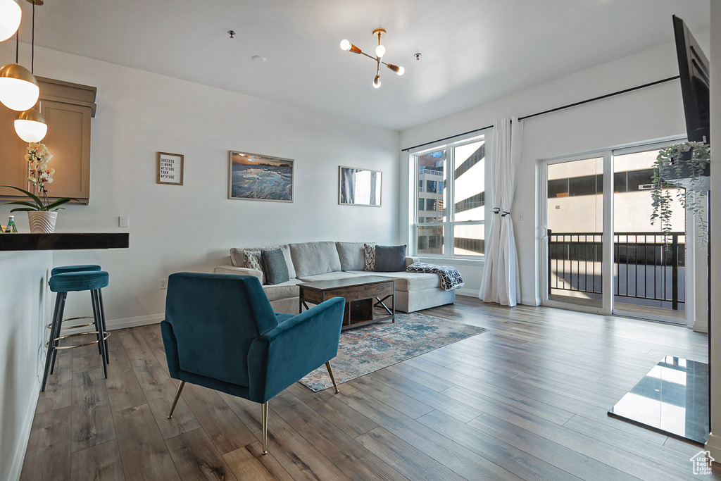 Living area featuring baseboards and wood finished floors