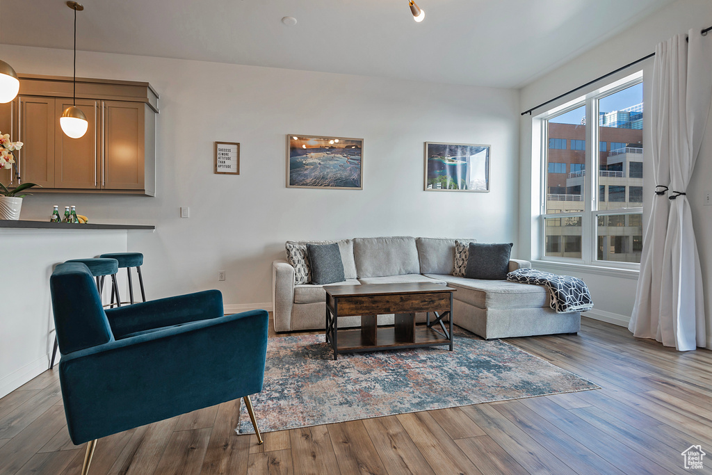 Living room with baseboards and wood finished floors