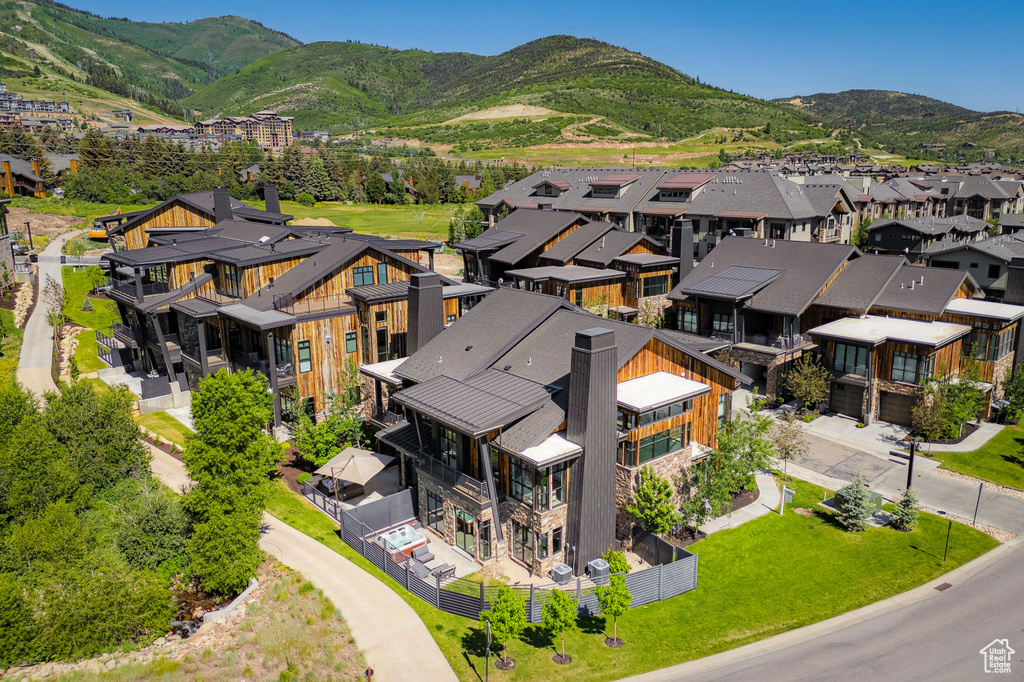 Aerial view of residential area with a mountainous background
