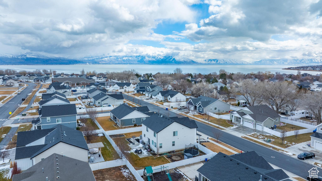 Birds eye view of property with a residential view and a water view