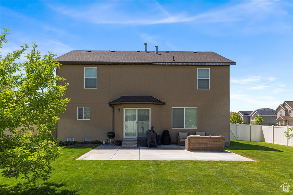 Back of house with a patio, an outdoor hangout area, and stucco siding