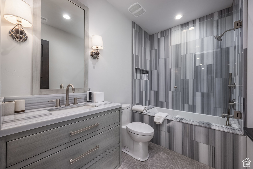 Full bathroom with vanity and recessed lighting