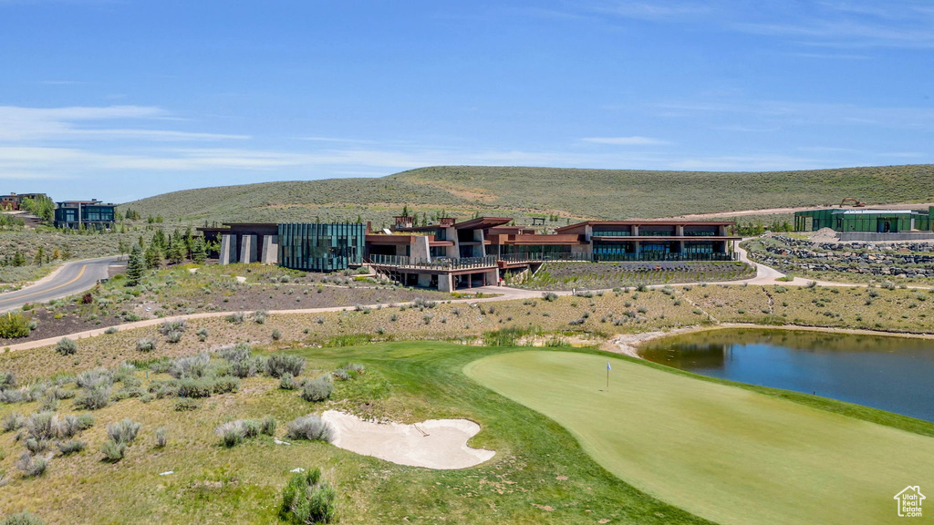 Bird's eye view of a golf club and a water and mountain view