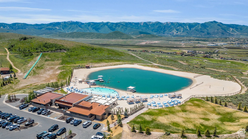 Aerial view of a water and mountain view and a pool