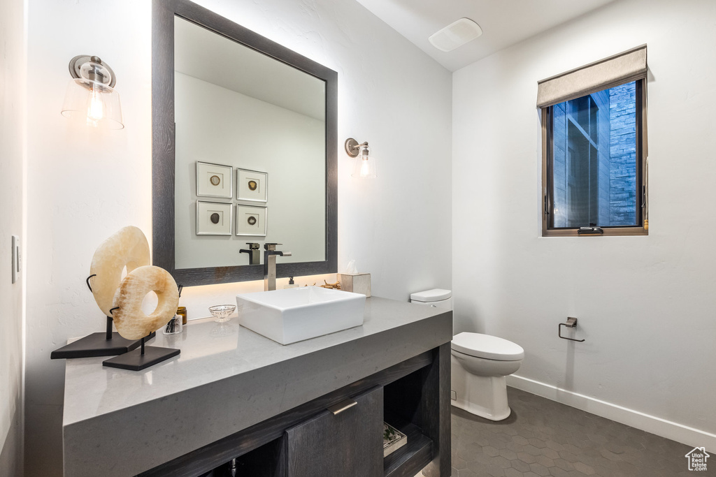 Bathroom featuring toilet and vanity