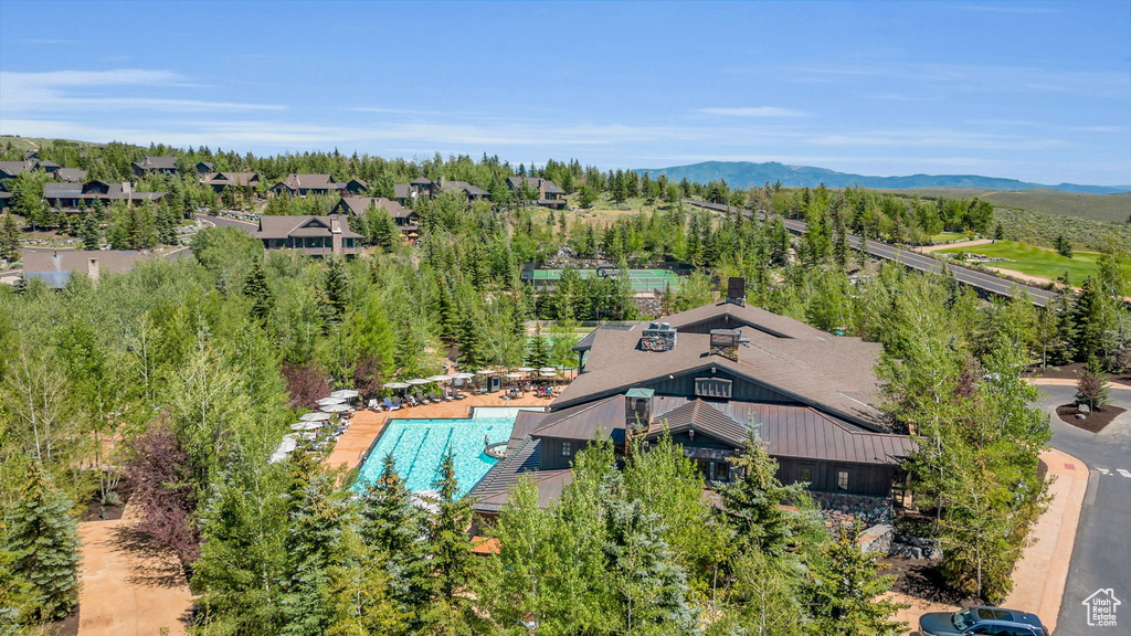 Drone / aerial view of a mountainous background and a pool