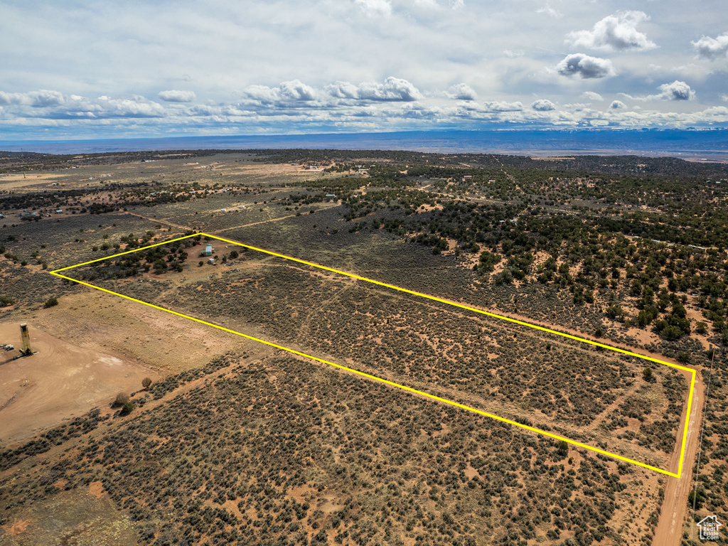 Drone / aerial view featuring a desert view and a rural view