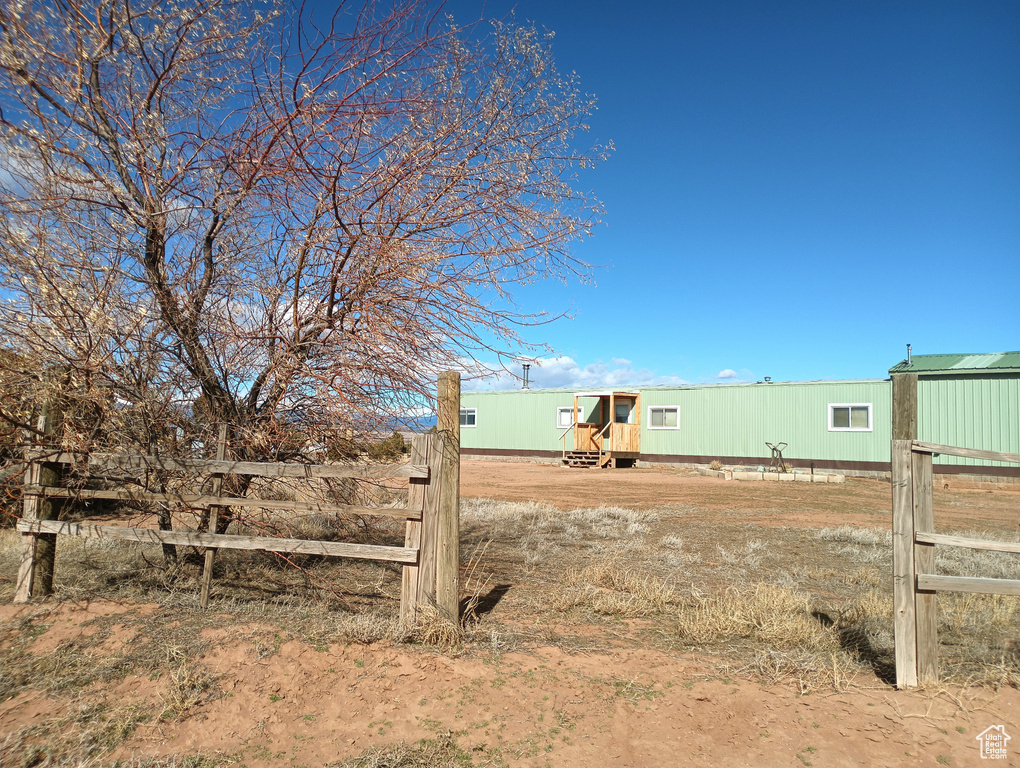 View of yard featuring fence
