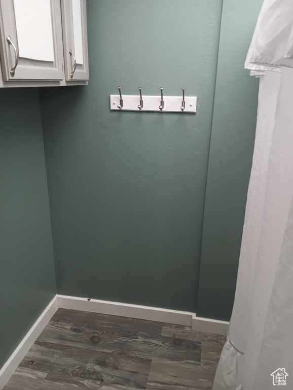 Interior space featuring baseboards and dark wood finished floors