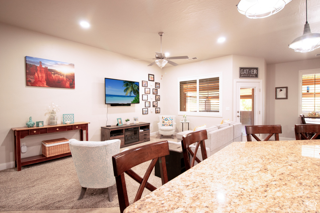 Dining area featuring a ceiling fan, recessed lighting, and carpet floors